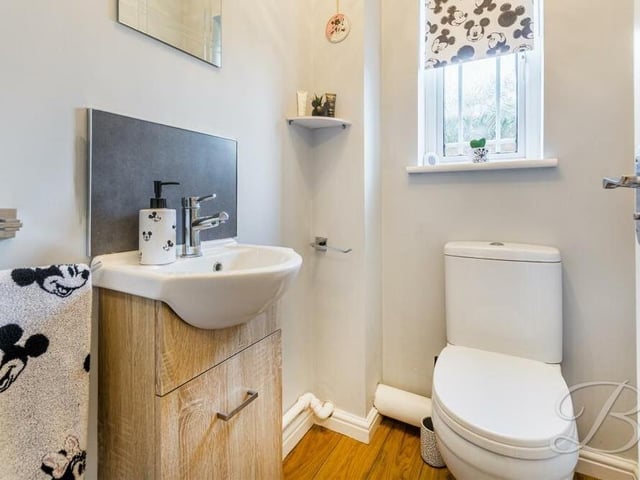 Our look at the ground floor is completed by this downstairs toilet, with hand wash basin and low-flush WC.