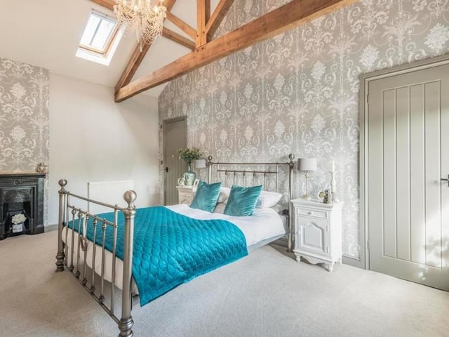Among the other attractive character features in the master bedroom is a cast-iron fireplace.