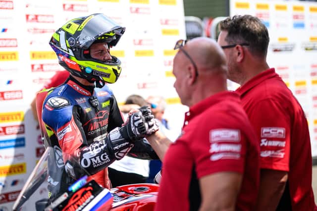 Kyle Ryde with his team in the pits at Snetterton. Photo by Michael Hallam.