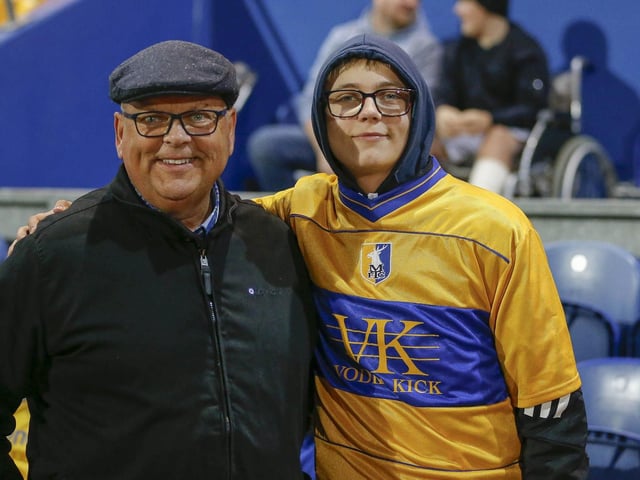 Mansfield Town fans watching the draw with Wrexham.