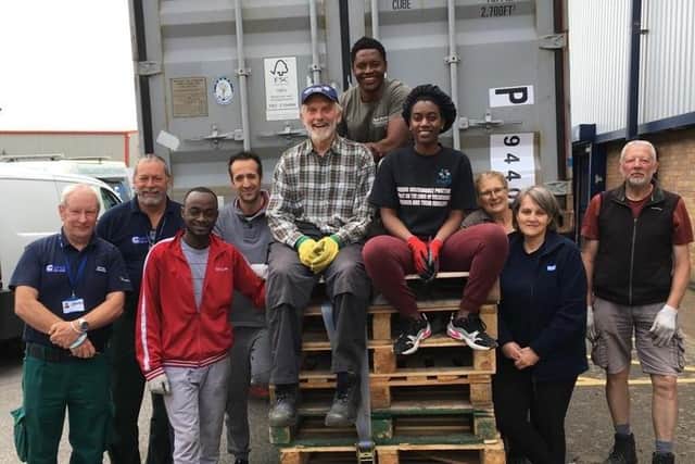 NPAC volunteers with one of the charity's shipping containers.