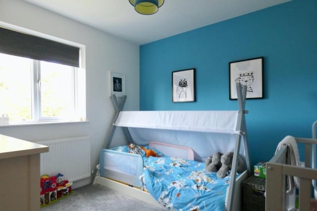 Like the second bedroom, the third is also currently set up for young children. A bright and compact corner of the house.