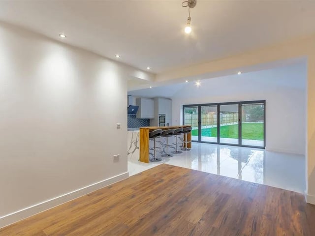The light and bright kitchen/dining area is filled with natural light