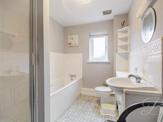 The perfect place to unwind after a busy day, the bathroom features a stylish four-piece family bathroom with a bath, walk-in shower, toilet and hand wash basin.