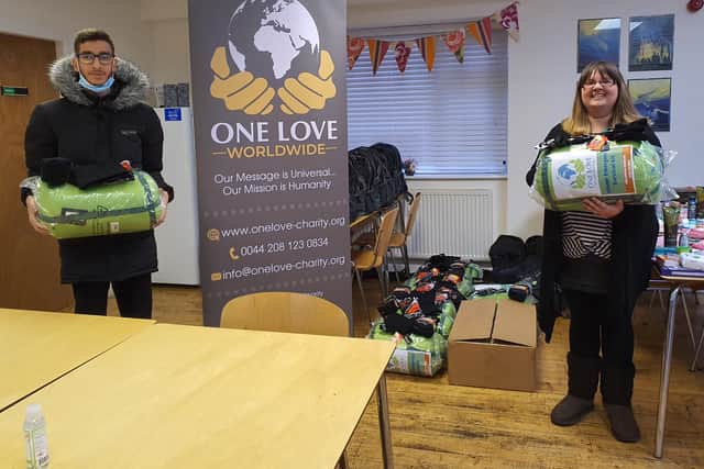 The kits were handed over by Sufyaan Azam, representing the One Love Worldwide charity to Mansfield's Beacon House homeless project manager Louisa Hillman.