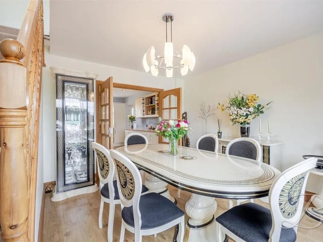 The dining room offers a bright and inviting space, complemented by a window to the front elevation that allows natural light to fill the room.