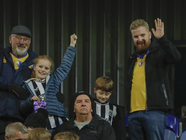 Fans at the Bristol Street Motors Trophy, Mansfield Town v Newcastle Utd U21 at the One Call Stadium, 29 Oct 2024, Photo Credit Chris & Jeanette Holloway, The Bigger Picture.media : Mansfield Town enjoyed a good an encouraging win over Newcastle with the squad players showing their quality.