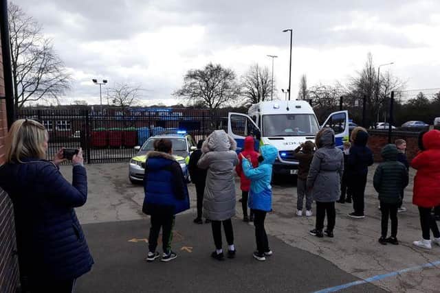 Pupils at Forest Town Primary School meet police officers.
