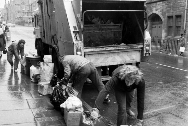When the strike ends, Edinburgh's dustmen get back to work clearing the rubbish from Easter Road in March 1982.