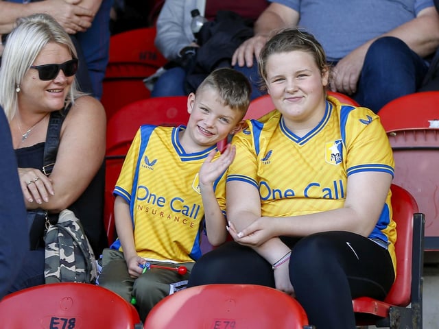 Mansfield Town fans watch the 1-1 draw at Grimsby in League Two.