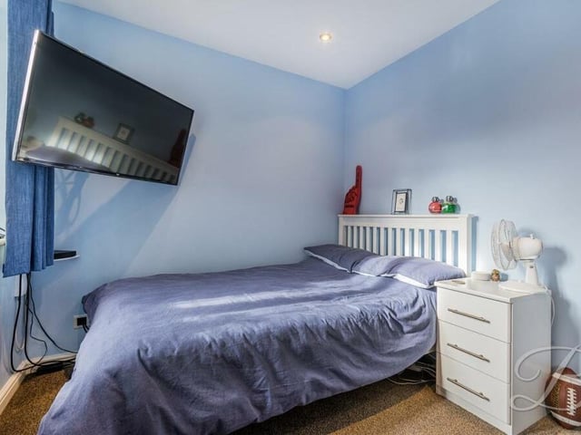 The second bedroom at the £360,000-plus Forest Town house is a good-sized double, with a fitted wardrobe and a carpeted floor.