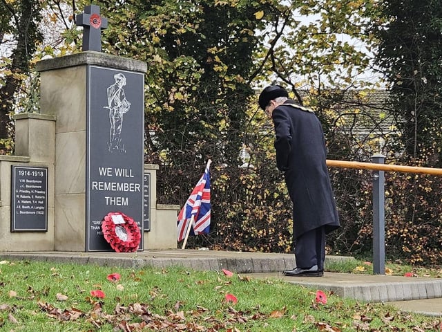 Laying a wreath at the war memorial in Nuthall's Basil Russell Park.