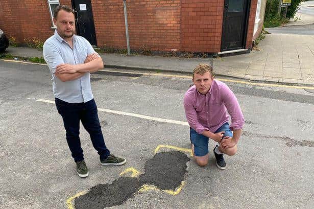 Couns Jason Zadrozny, left, and Coun Tom Hollis with a ViaFix road repair in Ashfield, which the Ashfield Indpendents say are 'botch jobs'