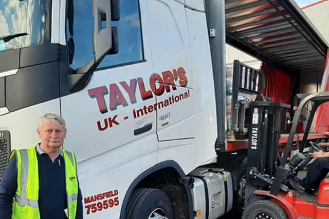 Alan Taylor, managing director of Taylor's, oversees another lorry being loaded with food bank supplies