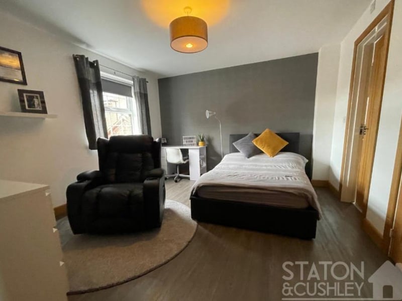The other four bedrooms are on the first floor, including this good-sized one, which boasts fitted wardrobes. There is space for a desk or dressing table and a comfy chair.