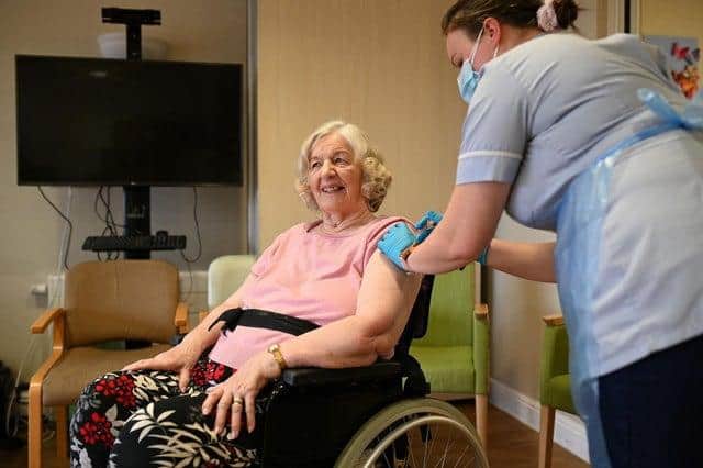 Woman receives her Covid-19 jab