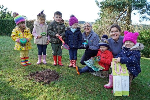 Laura Gapski, Bright Sparks manager, and Laura Hammond, deputy manager, with some of the nursery children.