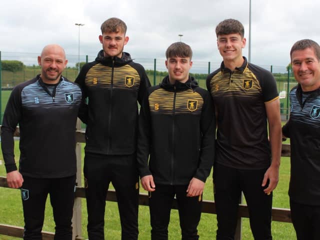 Richard Cooper, left and Nigel Clough with the young trio who have signed deals.