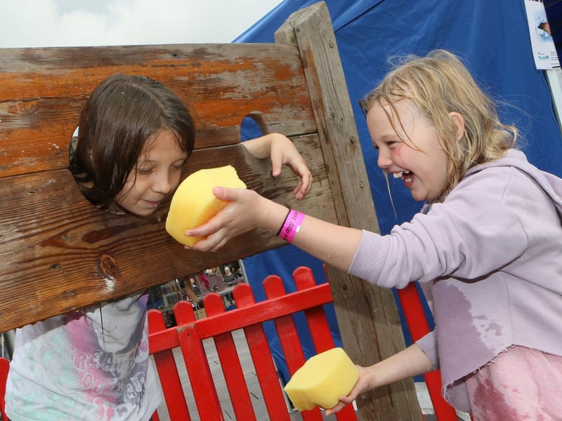 Julia Kowaclczyk and Freya Strouther took turns in the stocks for sponge-throwing fun.