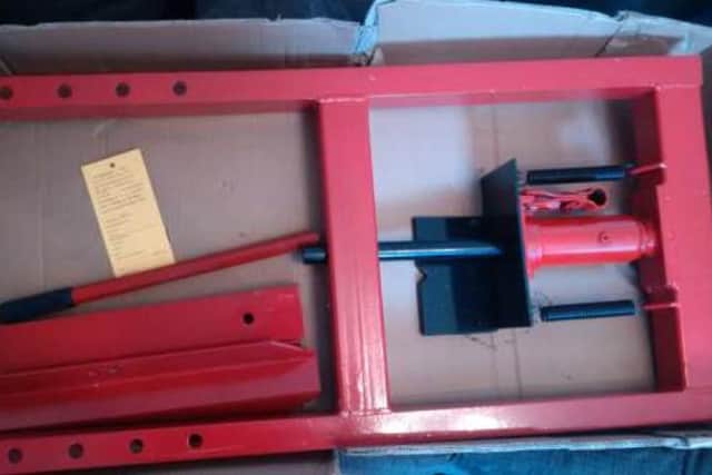 A hydraulic press which was found at the property.