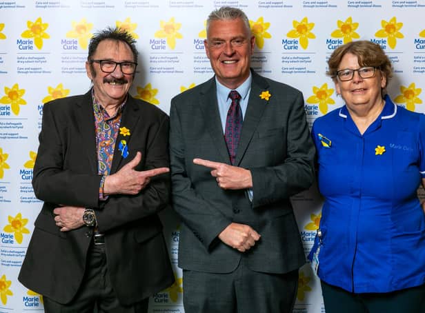 Lee Anderson MP, left, with Paul Chuckle and a Marie Curie representative.