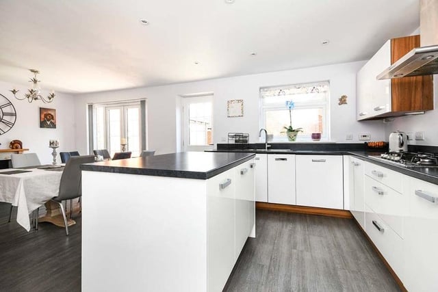 The modern dining kitchen is beautifully fitted, with a range of integrated appliances. These include a washing machine, dishwasher, fridge/freezer, high-level electric oven and grill, and five-ring gas hob. There is also lots of storage space and a concealed boiler.