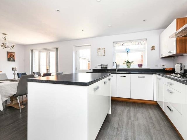 The modern dining kitchen is beautifully fitted, with a range of integrated appliances. These include a washing machine, dishwasher, fridge/freezer, high-level electric oven and grill, and five-ring gas hob. There is also lots of storage space and a concealed boiler.