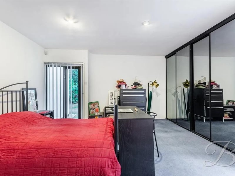 This exceptional principal bedroom features built-in wardrobes and an adjoining ensuite, complete with a four-piece suite and access to an indulgent sauna, perfect for unwinding. The bedroom has duel floor-length windows, while the patio doors open to a private balcony that extends the living area.