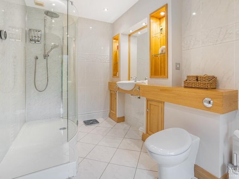 As well as the family bathroom on the first floor, there are three en suite rooms, including this one to the master bedroom. Complete with walk-in shower, it is contemporary and classy.