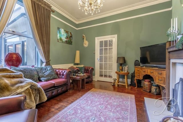 The second reception room, this sumptuous sitting room, complements the living room perfectly. It features hardwood flooring, period coving and a picture rail. The window faces the back of the property.