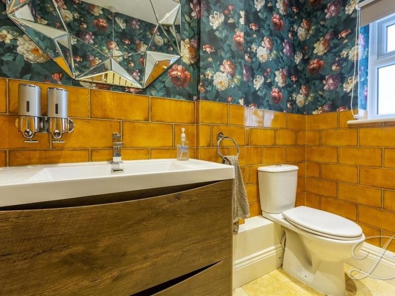 Here is the downstairs toilet, complete with low-flush WC and was hand basin.