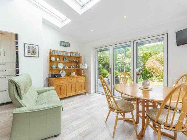 The breakfast or garden room also boasts a storage cupboard and bi-fold doors that lead out to the back garden