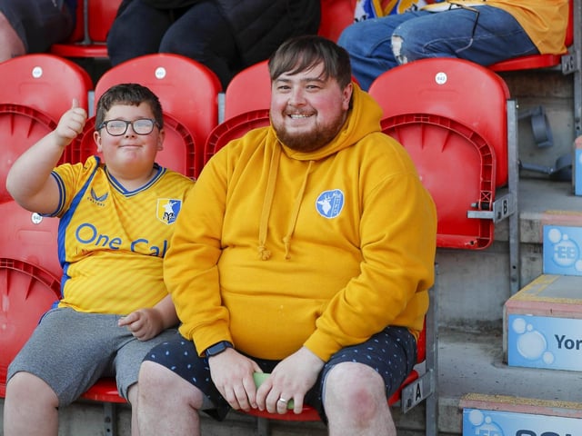 Mansfield Town fans watch the 2-2 draw at Doncaster.