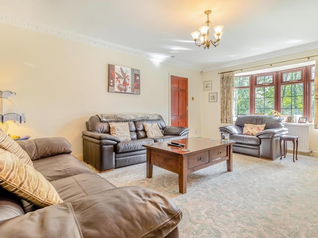 Another overview of the lounge, which is as bright, thanks to a large, double-glazed window facing the front of the house, as it is relaxing. Coving to the ceiling adds to its class.