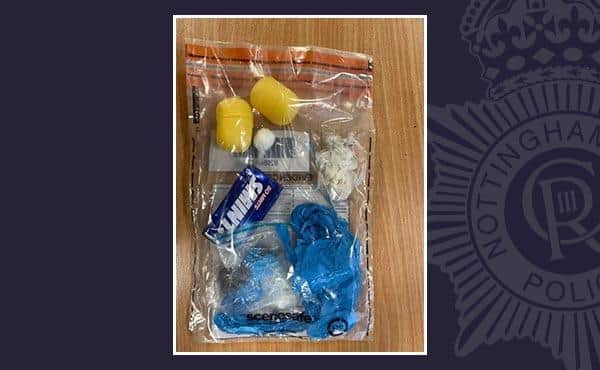 A suspected handgun, ammunition, drugs and a knife were all seized from a car after it crashed into a lamppost. Photo released by Nottinghamshire Police.