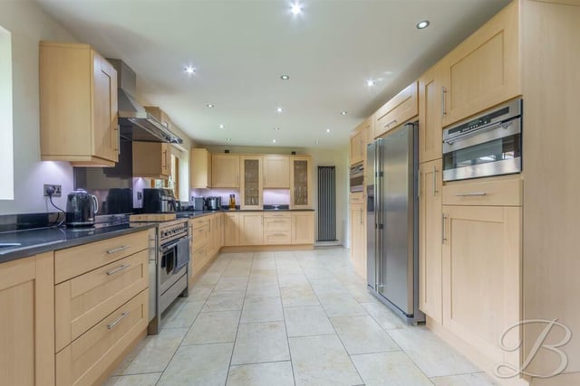At the heart of the £725,000 Birch Grove Gardens home is this remarkable kitchen/diner, which is where we launch our photo tour. It comes complete with a range of modern wall and base units, with complementary worktops over, inset sink and drainer with mixer tap.