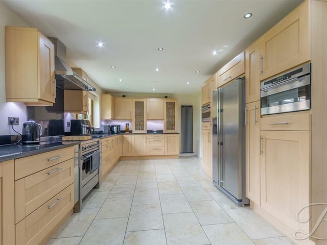 At the heart of the £725,000 Birch Grove Gardens home is this remarkable kitchen/diner, which is where we launch our photo tour. It comes complete with a range of modern wall and base units, with complementary worktops over, inset sink and drainer with mixer tap.