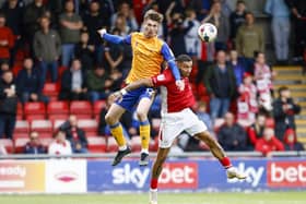 Mansfield Town defender Oli Hawkins heads clear during the win at Crewe. Photo: Chris Holloway/The Bigger Picture.media.