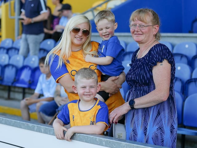 Mansfield fans watch the Carabao Cup first round match against Derby County FC at the One Call Stadium.