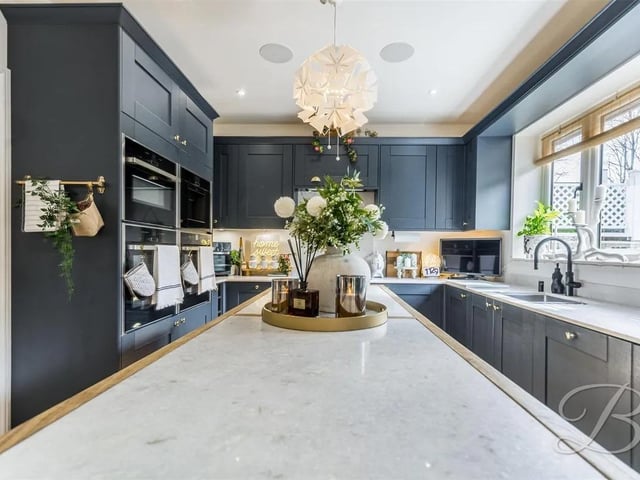 The heart of the home is this stunning kitchen/dining room, accessed through an interior fire door and complete with a range of modern matching wall and base units. The kitchen also benefits from integrated fridge freezer, dishwasher and TV point. The dining area has ample space for furnishings, the current owners have fitted a gorgeous bar with drinks fridge to enjoy next to the cosy log fire. There are patio doors leading to the rear garden and opening up to the living room creating a lovely social space.