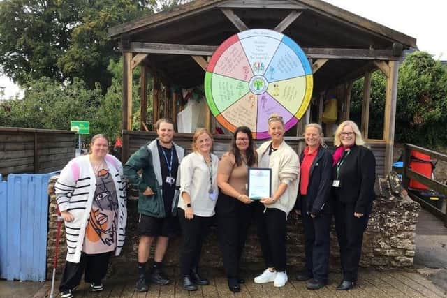 The school OPAL scheme working party with mentor Wendy Salon who presented the school with its Platinum Award. Photo: Submitted