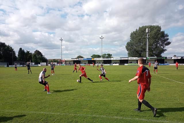 Jordan Wells (in red) v Brigg, Pic by Deb Wrigglesworth.