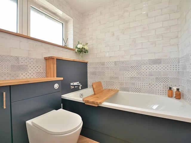 The family bathroom features a bath and separate shower and is packed with modern fixtures and fittings.