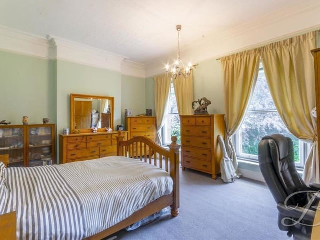 Next on the agenda for our tour of the Mansfield mansion is a look at the rest of the impressive bedrooms. This one, with carpeted floor and coving, is generously sized. It also has access to en suite facilities.