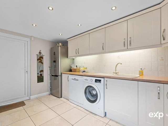 The large utility is fitted with wall and base units for plenty of useful additional storage. There is a handy sink and drainer, and plumbing for a washing machine, as well as plumbing for a dishwasher. There is also space for fridge/freezer here. A practical courtesy door leads through to the garage, and a personnel door to the rear. The room is decorated with tiled flooring, tiled splash backs, and there is a radiator.
