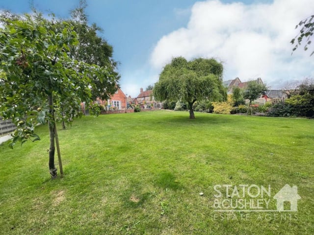 Another shot of the extensive lawn and variety of mature trees and shrubs that make up the garden at the £650,000-plus Mansfield Woodhouse property.