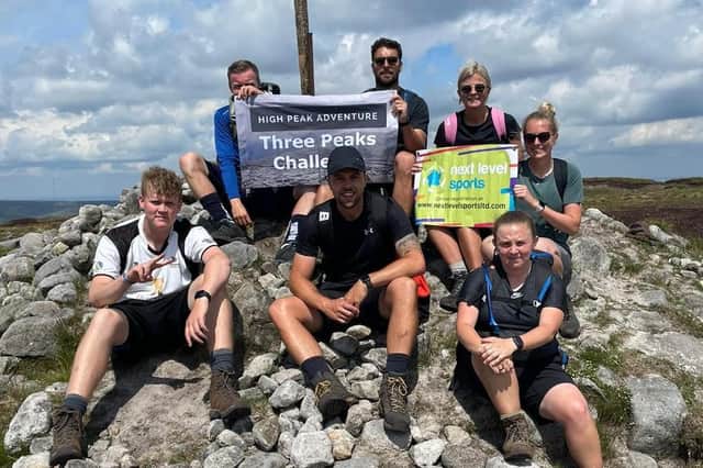 The Next Level Sports team, led by Scott Hardy (centre), reach one of their destinations in the Derbyshire Three Peaks Challenge.