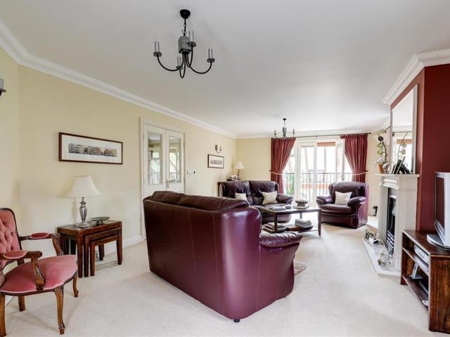 Your arrival on the first floor of the Ravenshead property is greeted by this large living room, where double doors at the far end open out on to a Juliet-style balcony. The room also has a feature fireplace with decorative surround, carpeted flooring and coving to the ceiling.