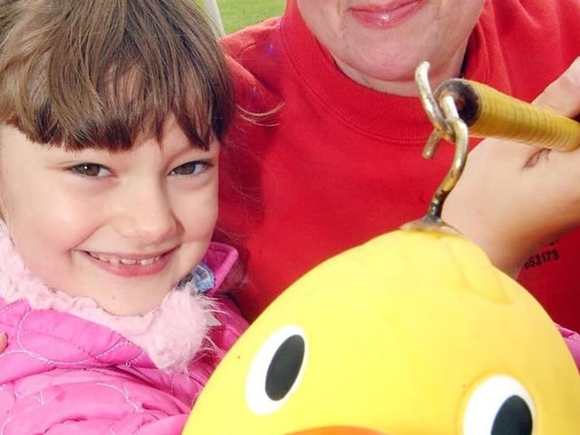 Mansfield Woodhouse's Mardi Gras back in 2007. Here is Jennifer Horner, aged seven at the time, hooking herself a duck on the Pet Bereavement stall run by Yvette Price-Mear.