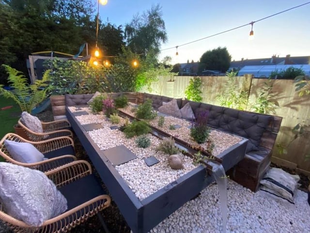 The back garden at the Kimberley property has been ingeniously adapted into an area for socialising during the summer. It includes this unique, living dining table, with water feature.
